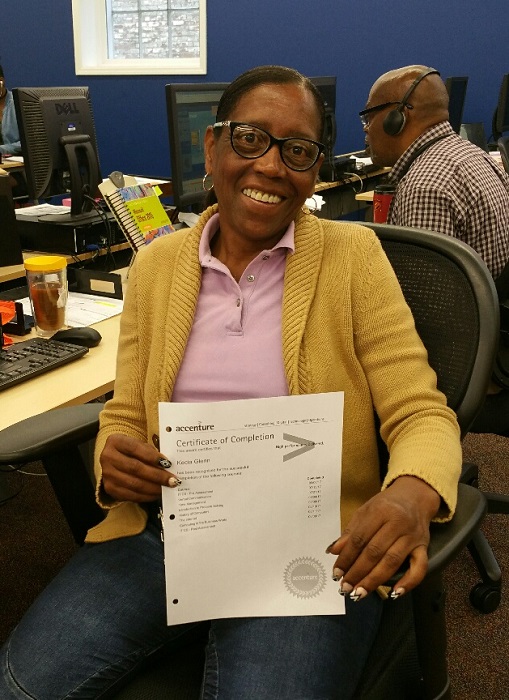 Trainee holding a certificate of completion.